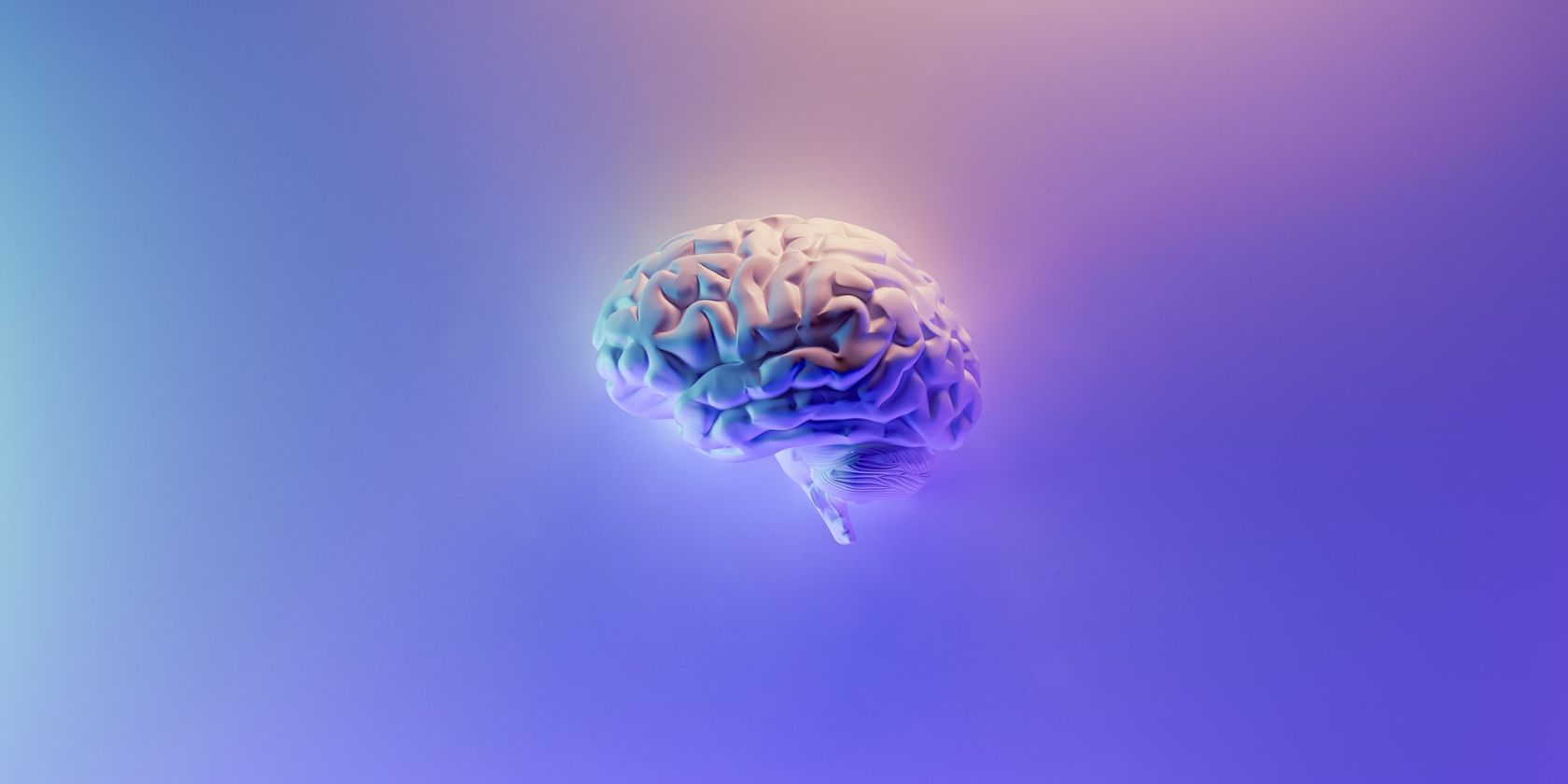 A 3D image of a brain in blue, purple, and pink ombre