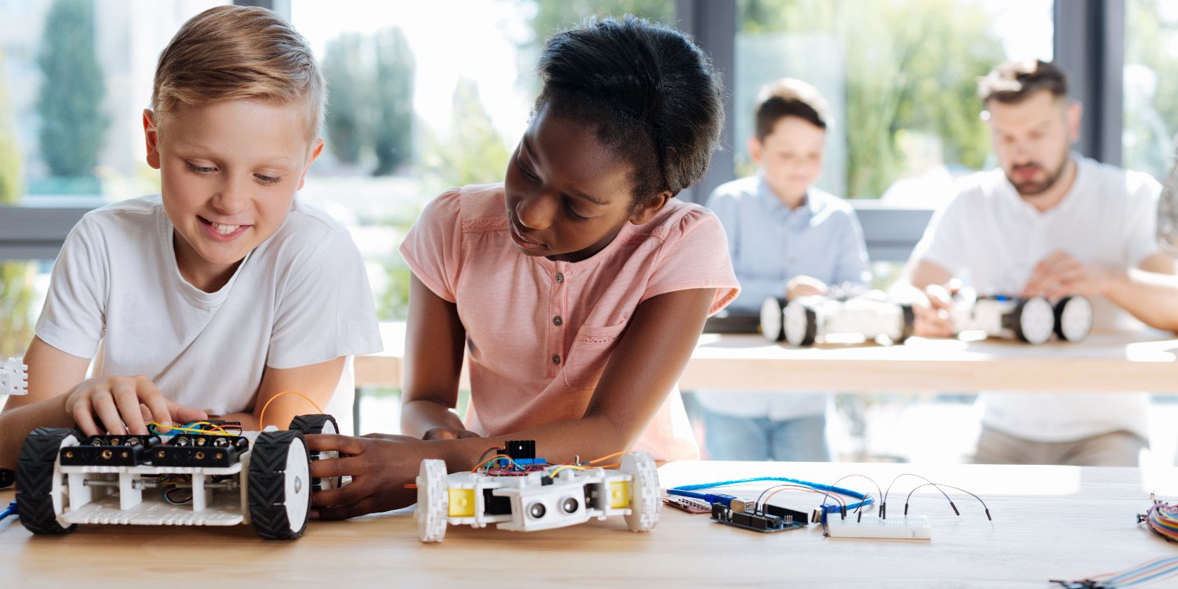 Little Kids doing Robotics. Robotic child vs Competition. Kid girl Robot. Robotics Kids banner in Classroom.