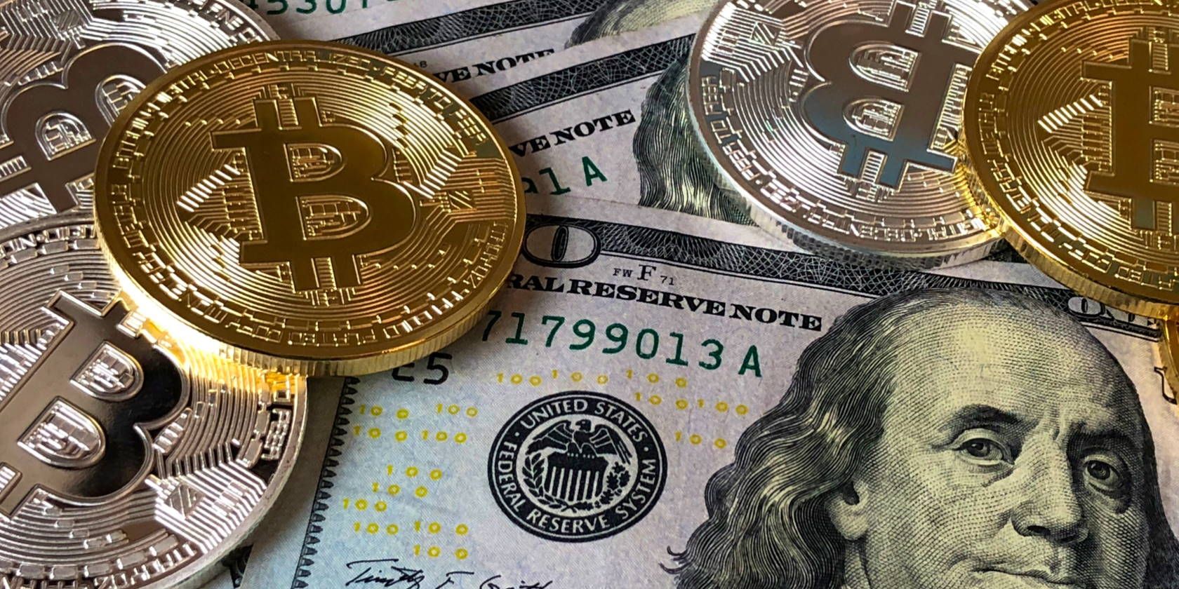 bitcoins-over-dollar-bills