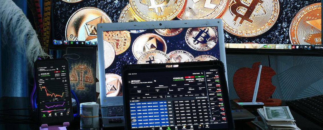 Image showing Crypto Coins and Charts on Laptops and Mobile Phones
