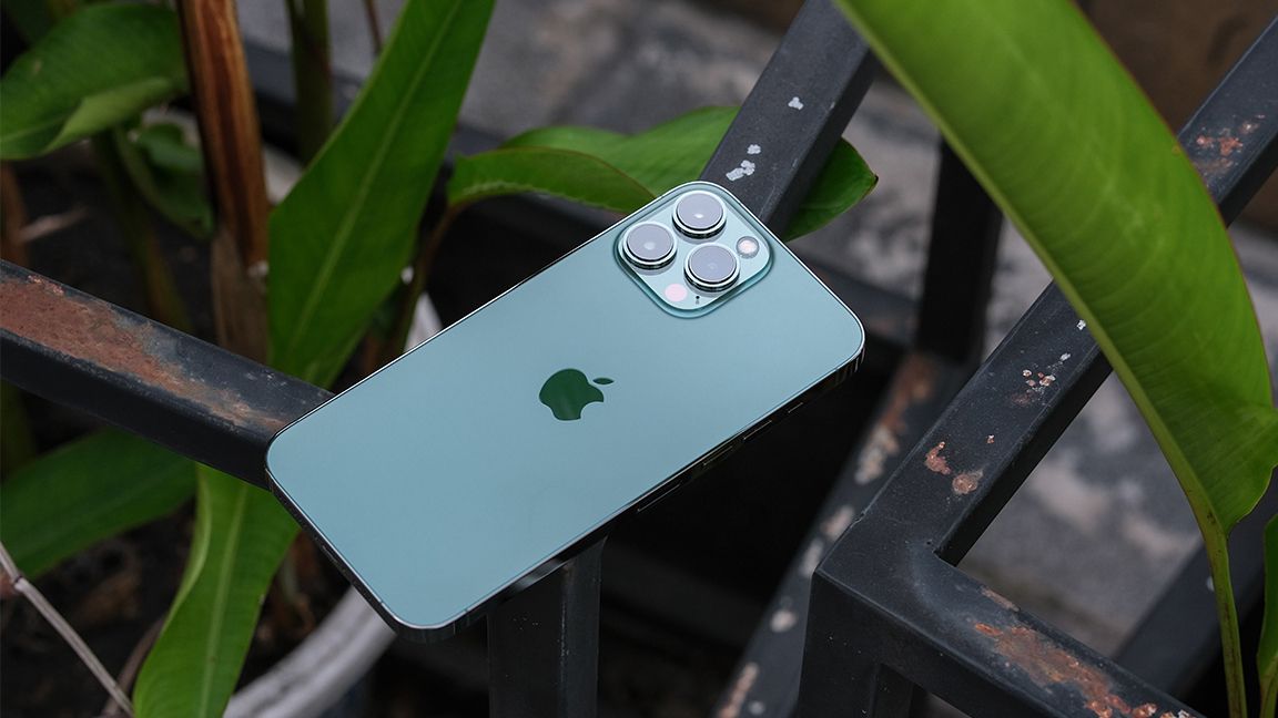 Green iPhone sitting outdoors