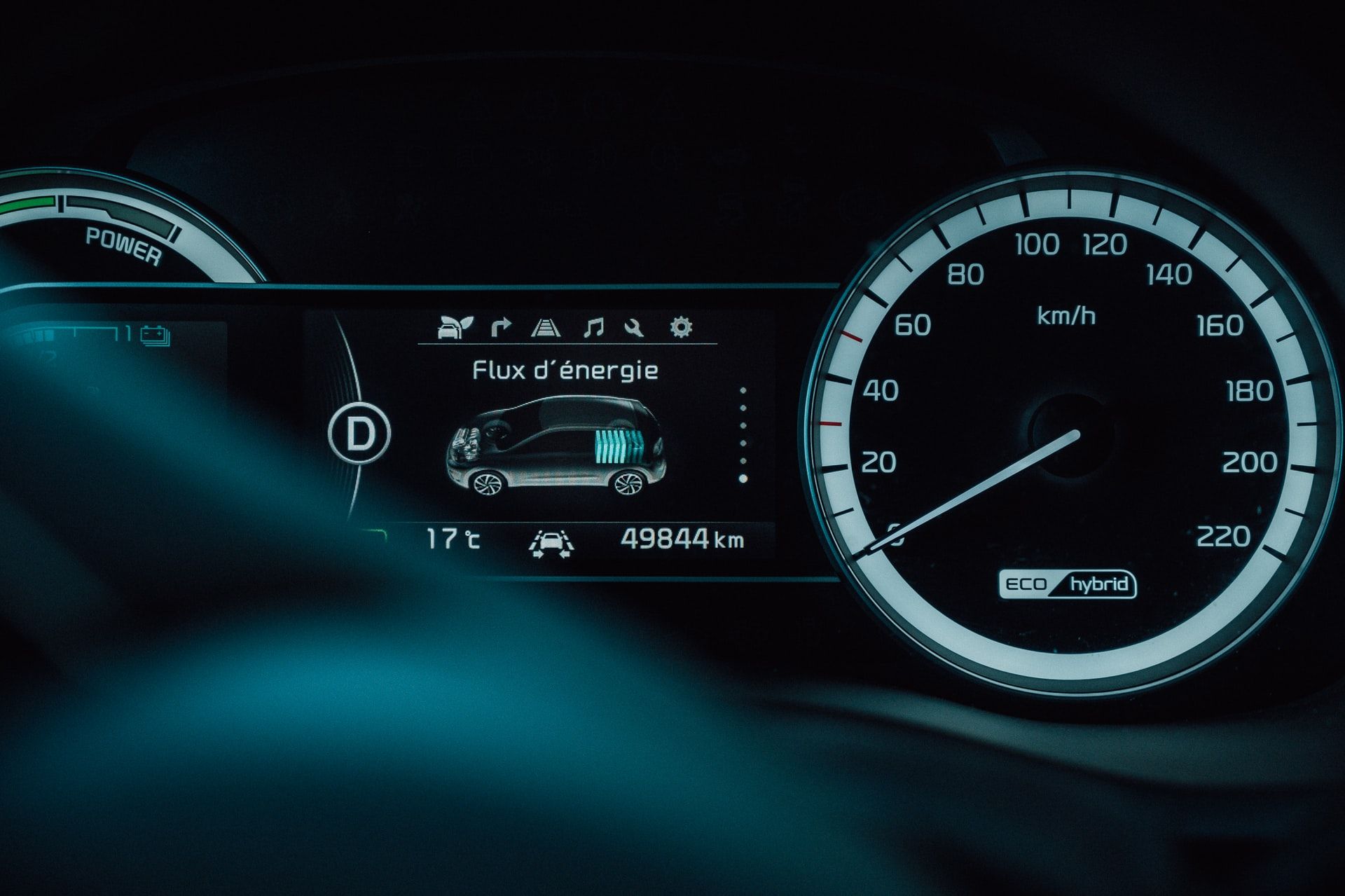 Image of a dashboard cluster showing hybrid power 