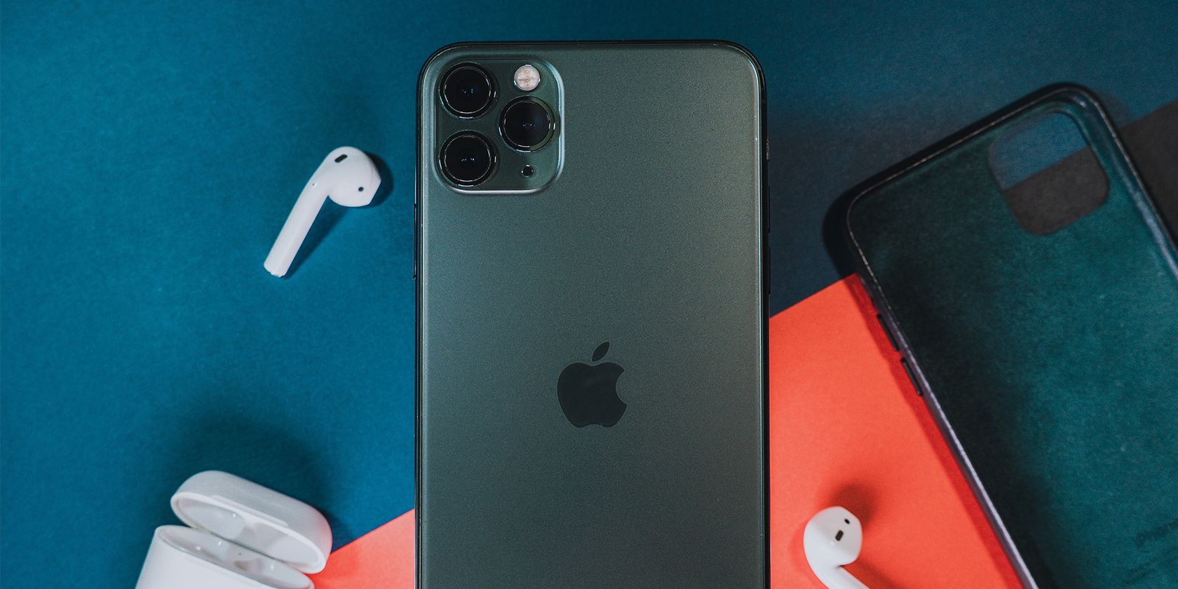 iPhone and AirPods on colorful background