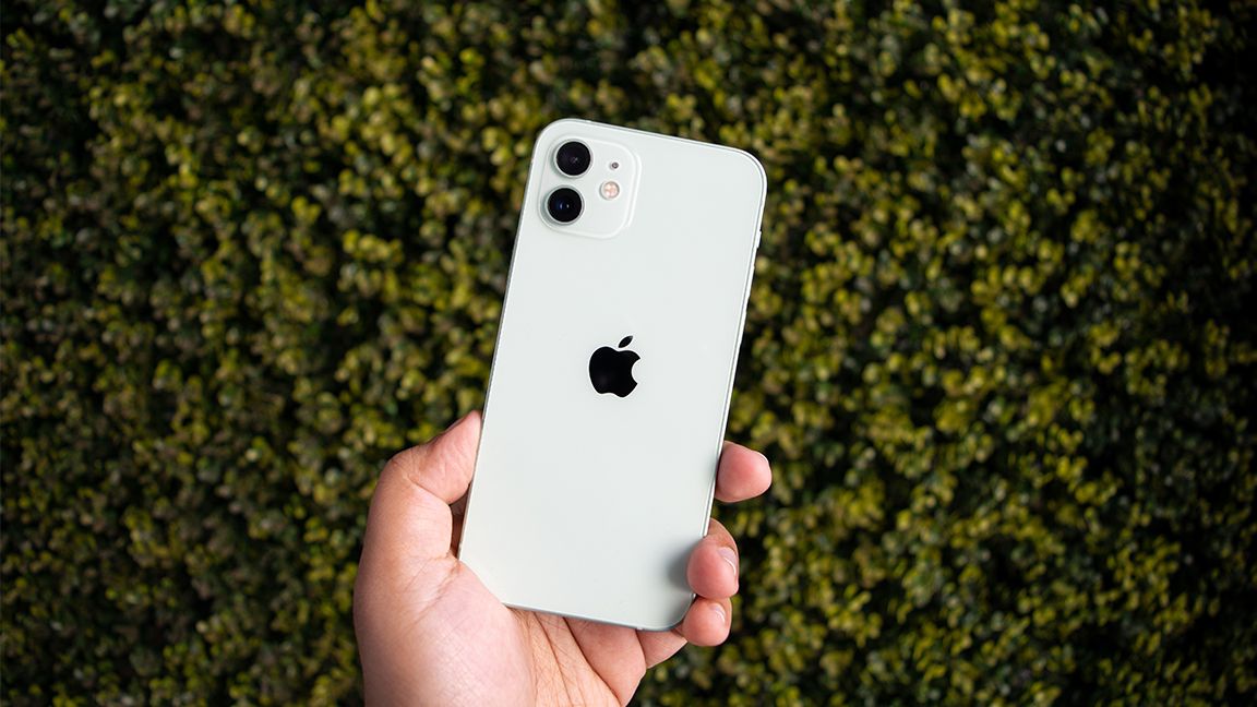 iPhone 12 with green background