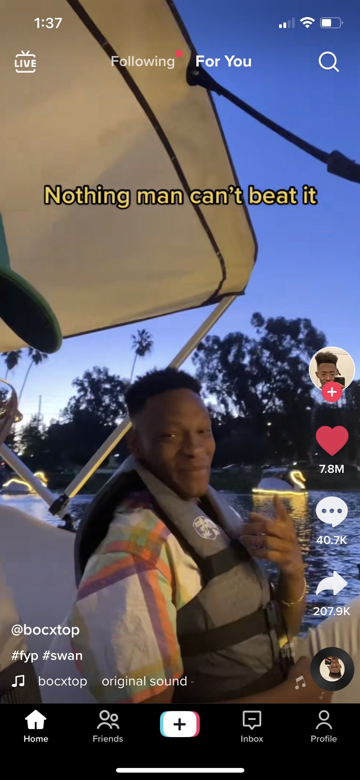 Screenshot of TikTok video of two guys on a paddle boat