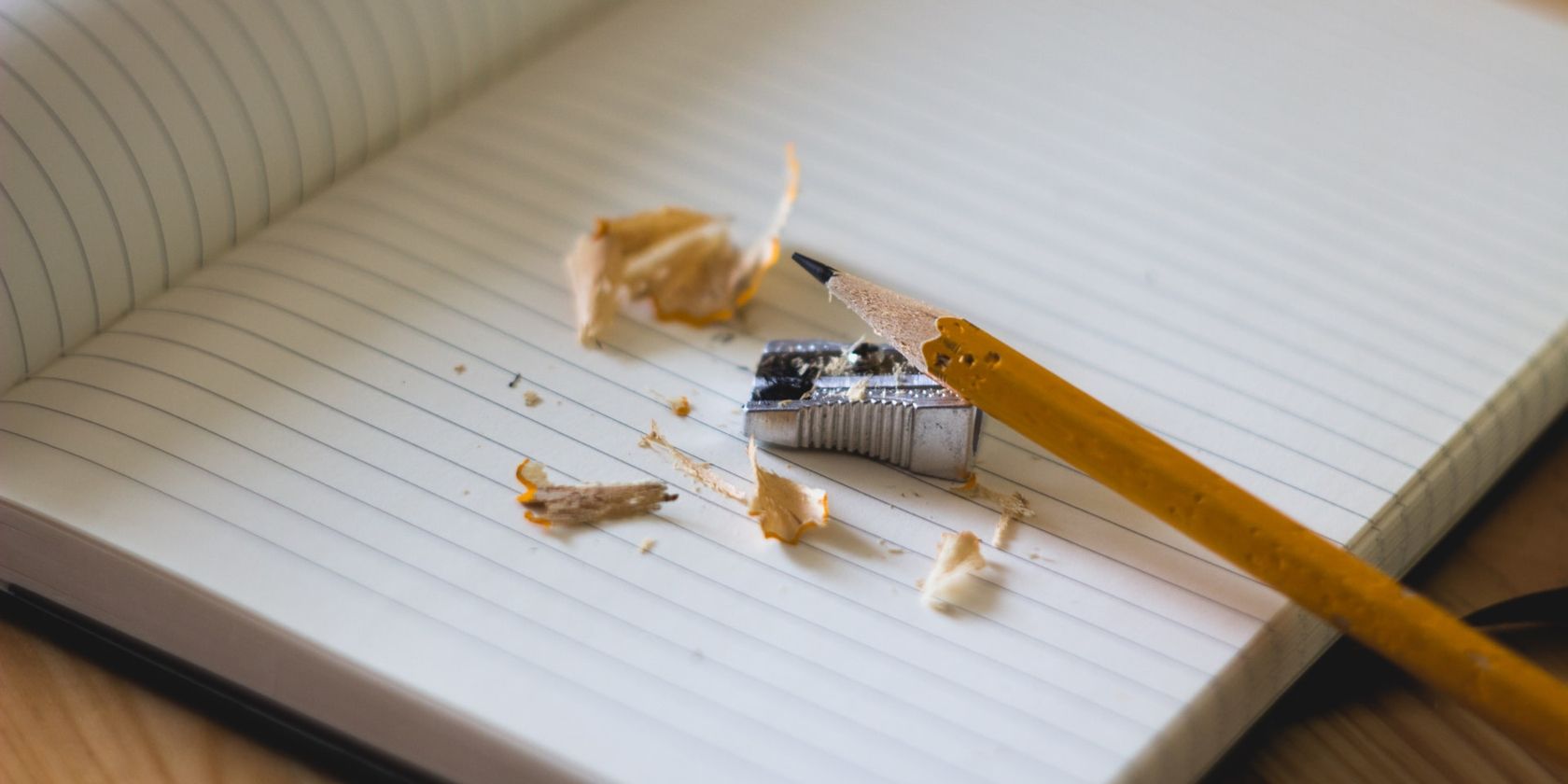 Pencil and Sharpener on Open Notebook