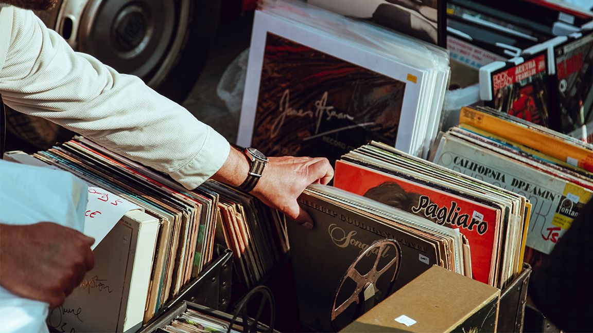Man browsing records at music shop