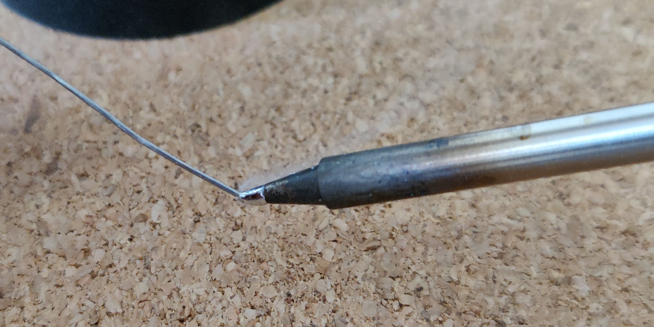 Melting solder onto the soldering iron tip