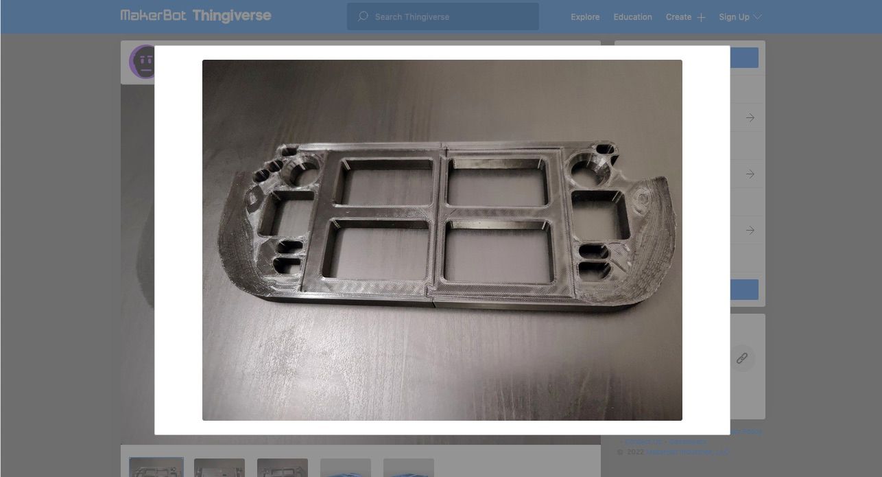 A 3D printed repair jig for the Steam Deck.