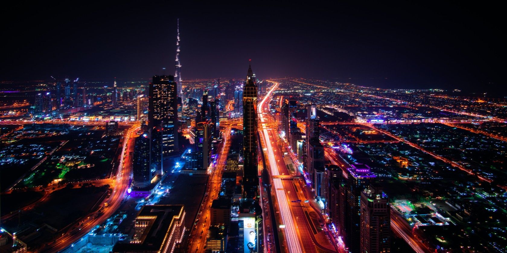 An aerial photograph of Dubai at night