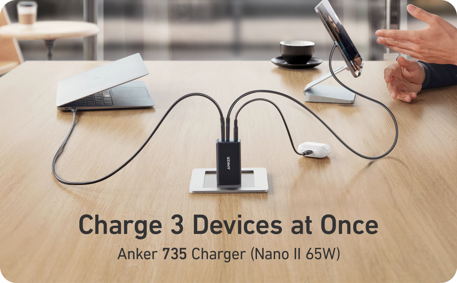 Anker 735 Charger plugged into MacBook, AirPods, and an iPad