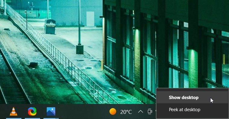 Clicking the Bottom-Right Corner of the Taskbar and Selecting Show Desktop