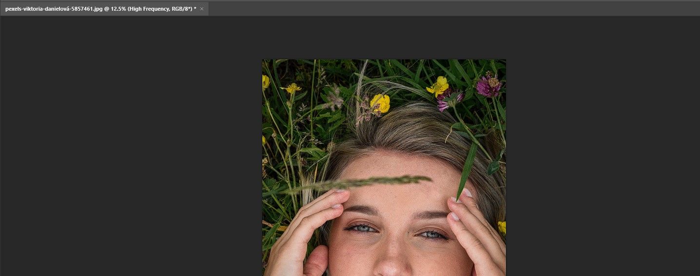 Woman lying in flowers