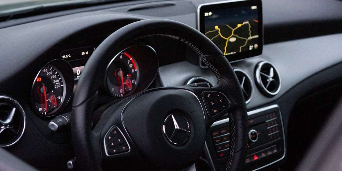The interior of a Mercedes Benz and its modern dashboard.