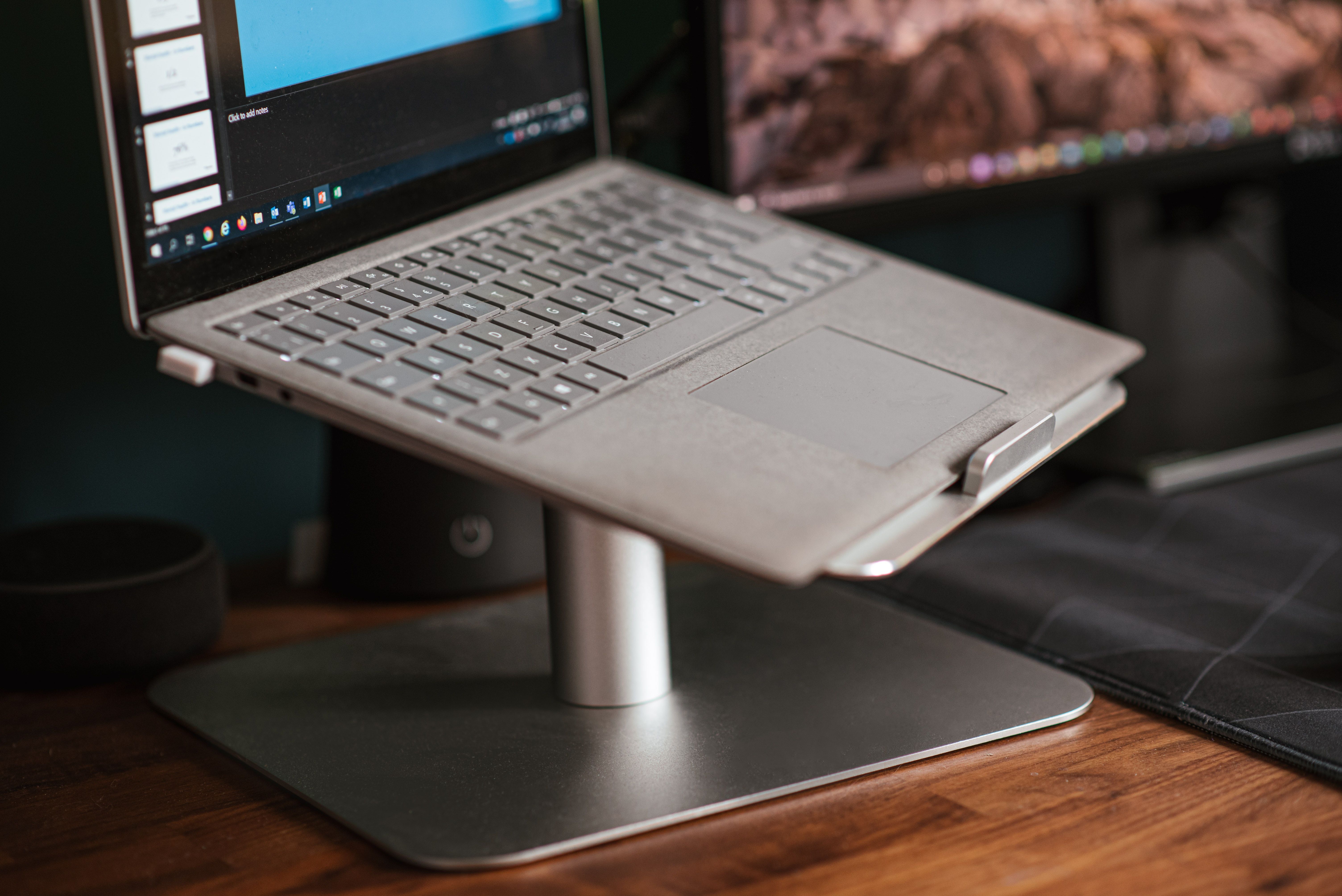 A laptop on a one-legged laptop stand