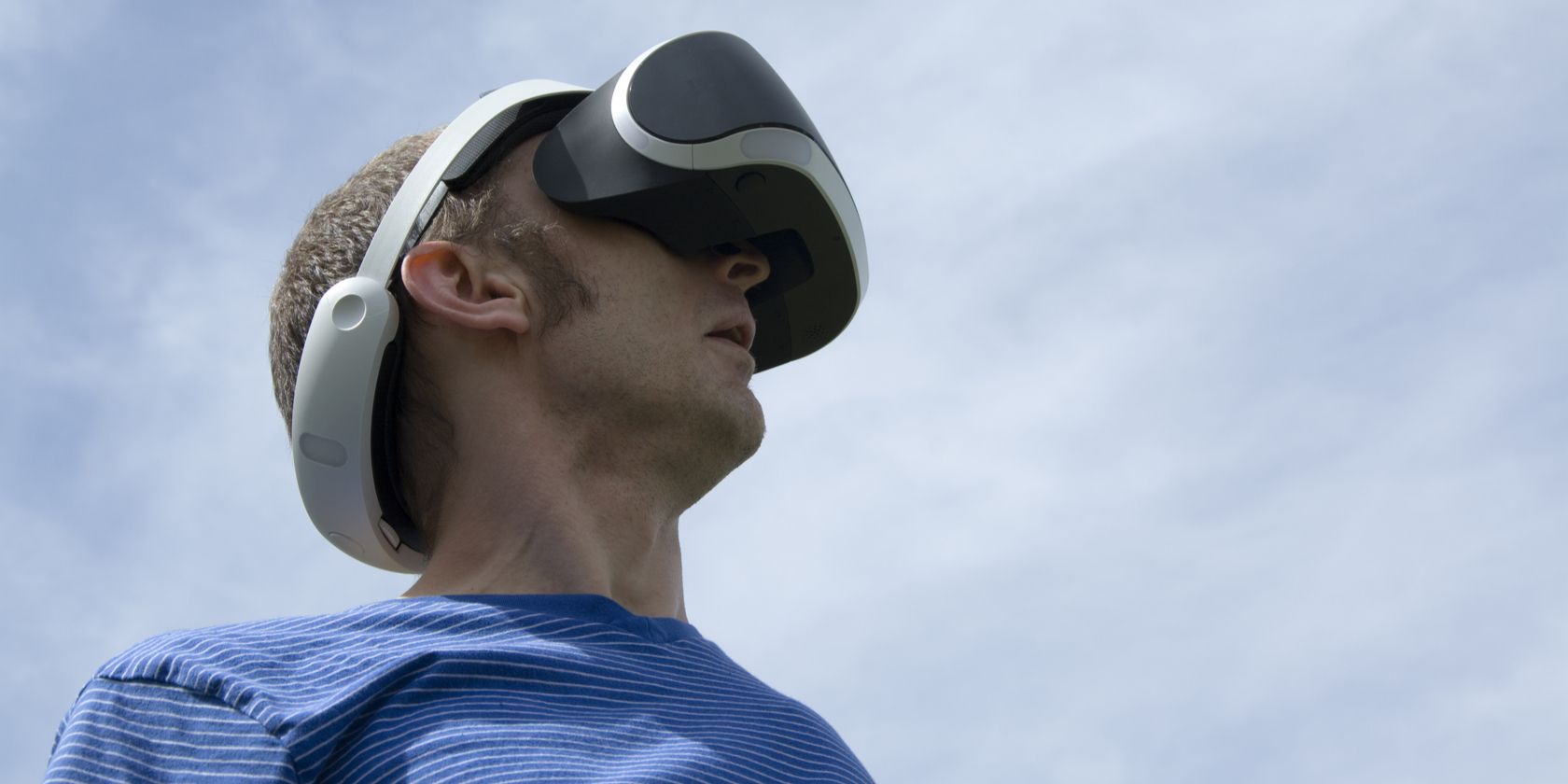 Man wearing PS VR headset outside