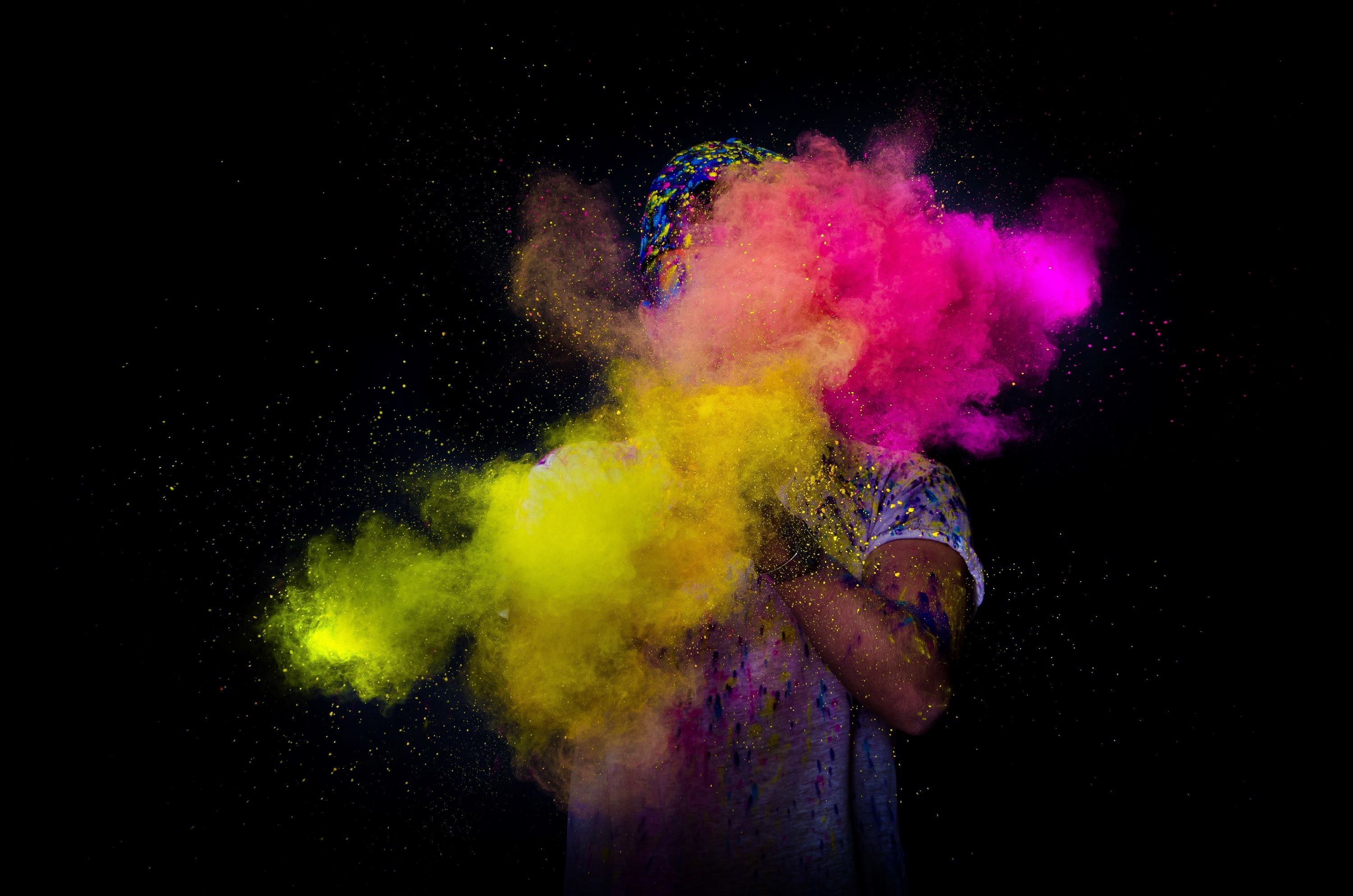 photo of a person throwing colorful powder