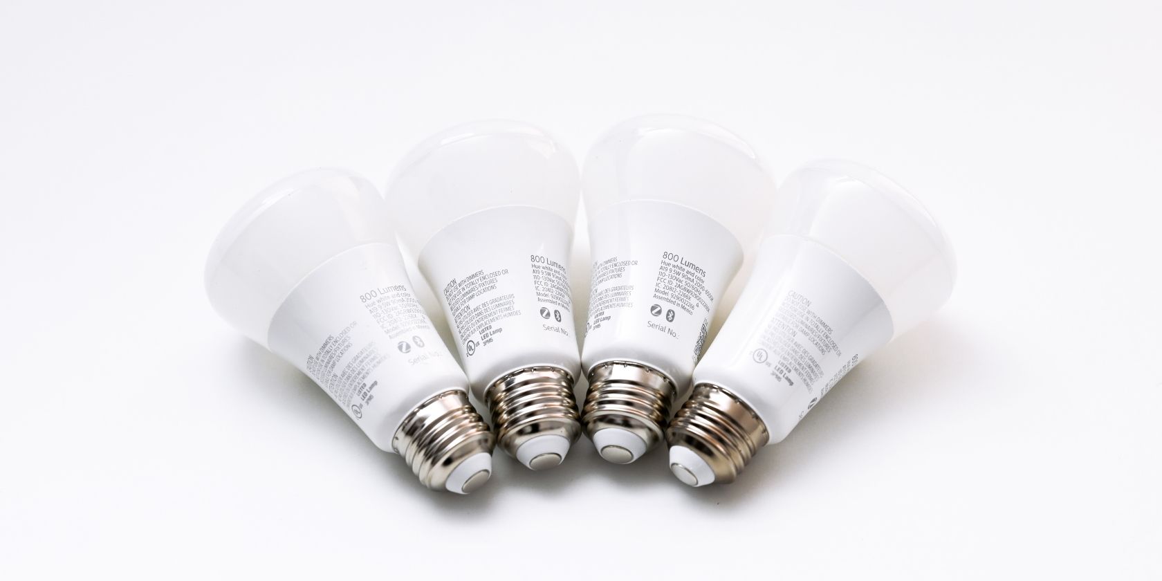 Four Philips Hue Lightbulbs on a White Background