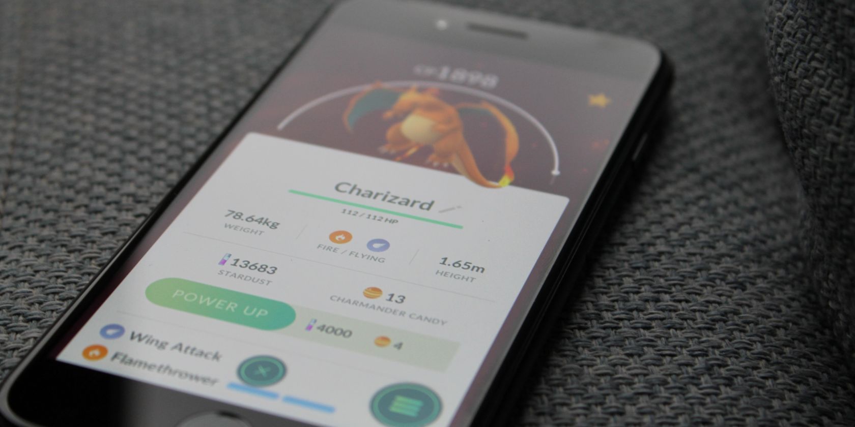 Pokémon GO mobile game on couch