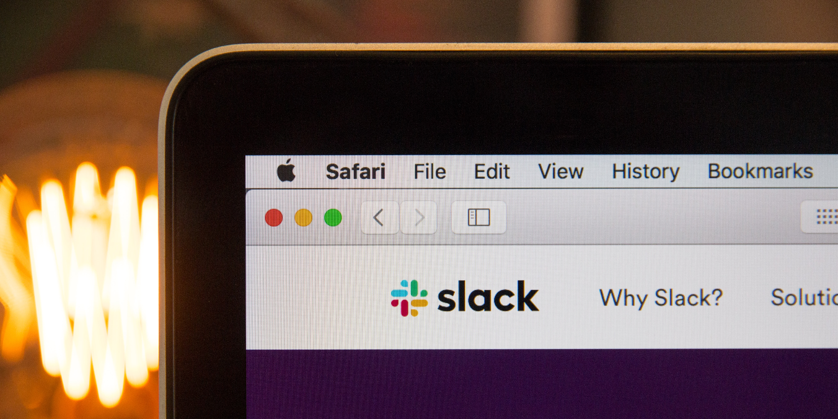 A picture of the Slack website on an open PC