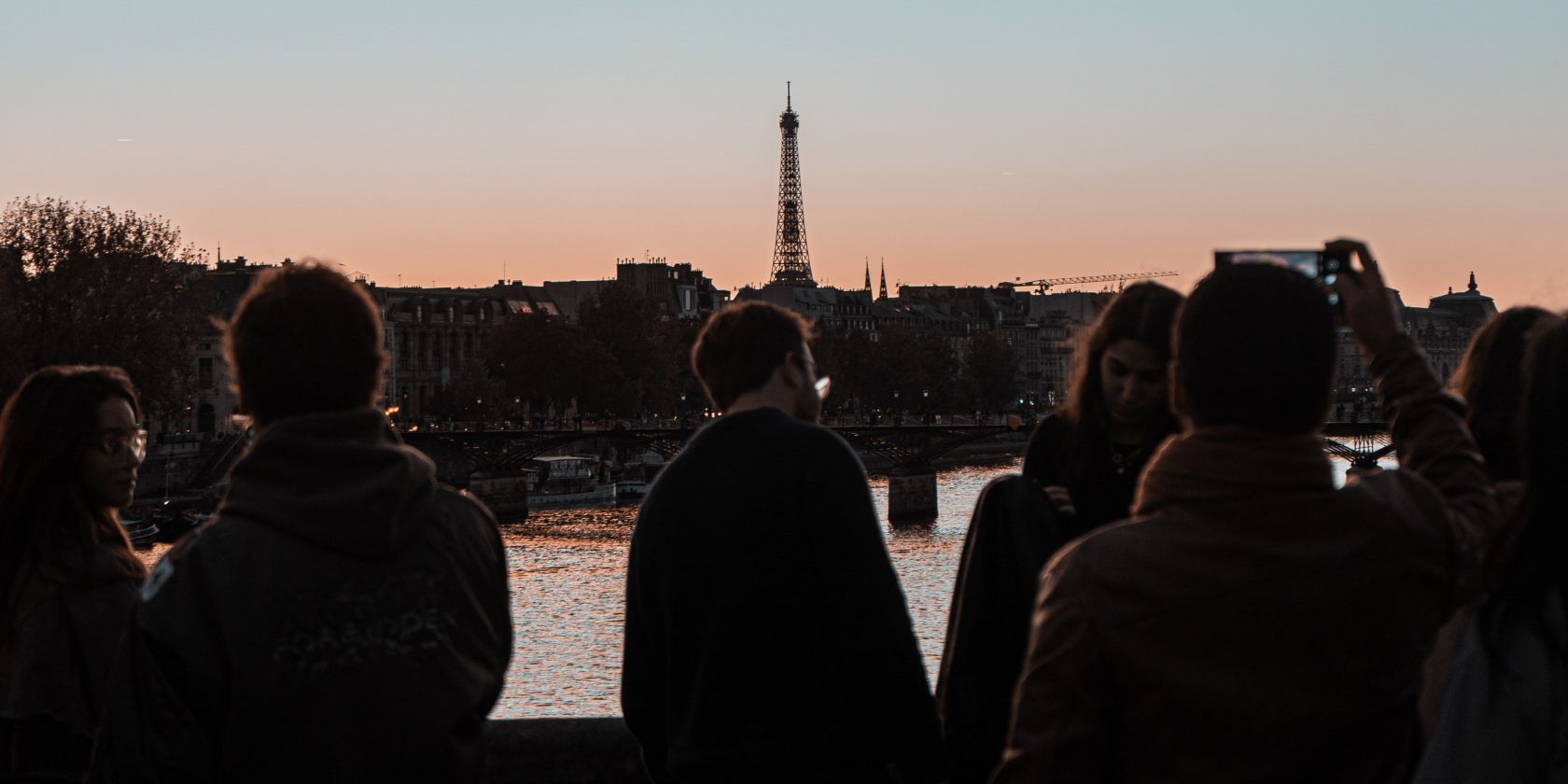 Photo of tourists close to the Eiffel Tower