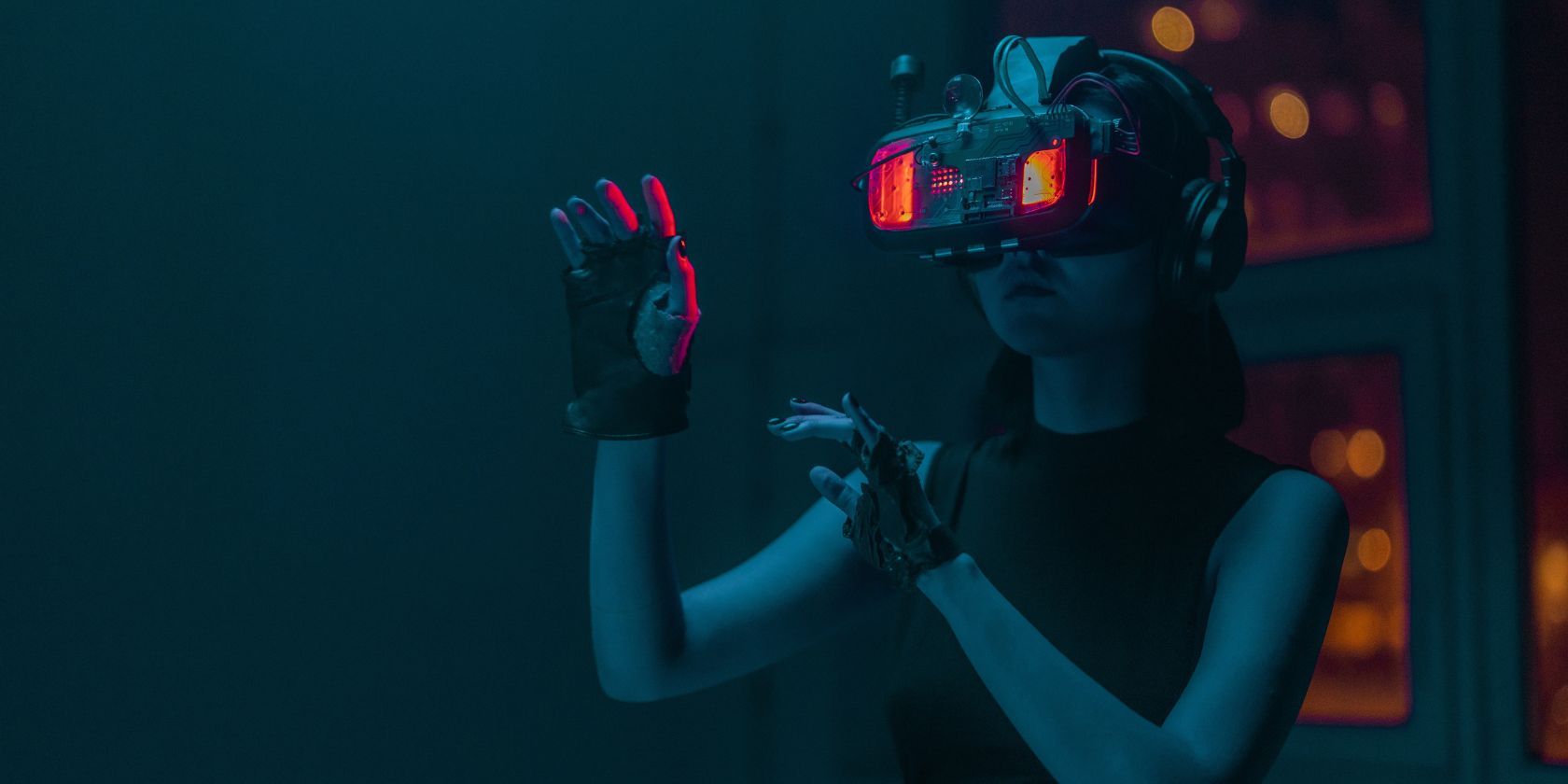 Woman in VR Headset in Dark Room