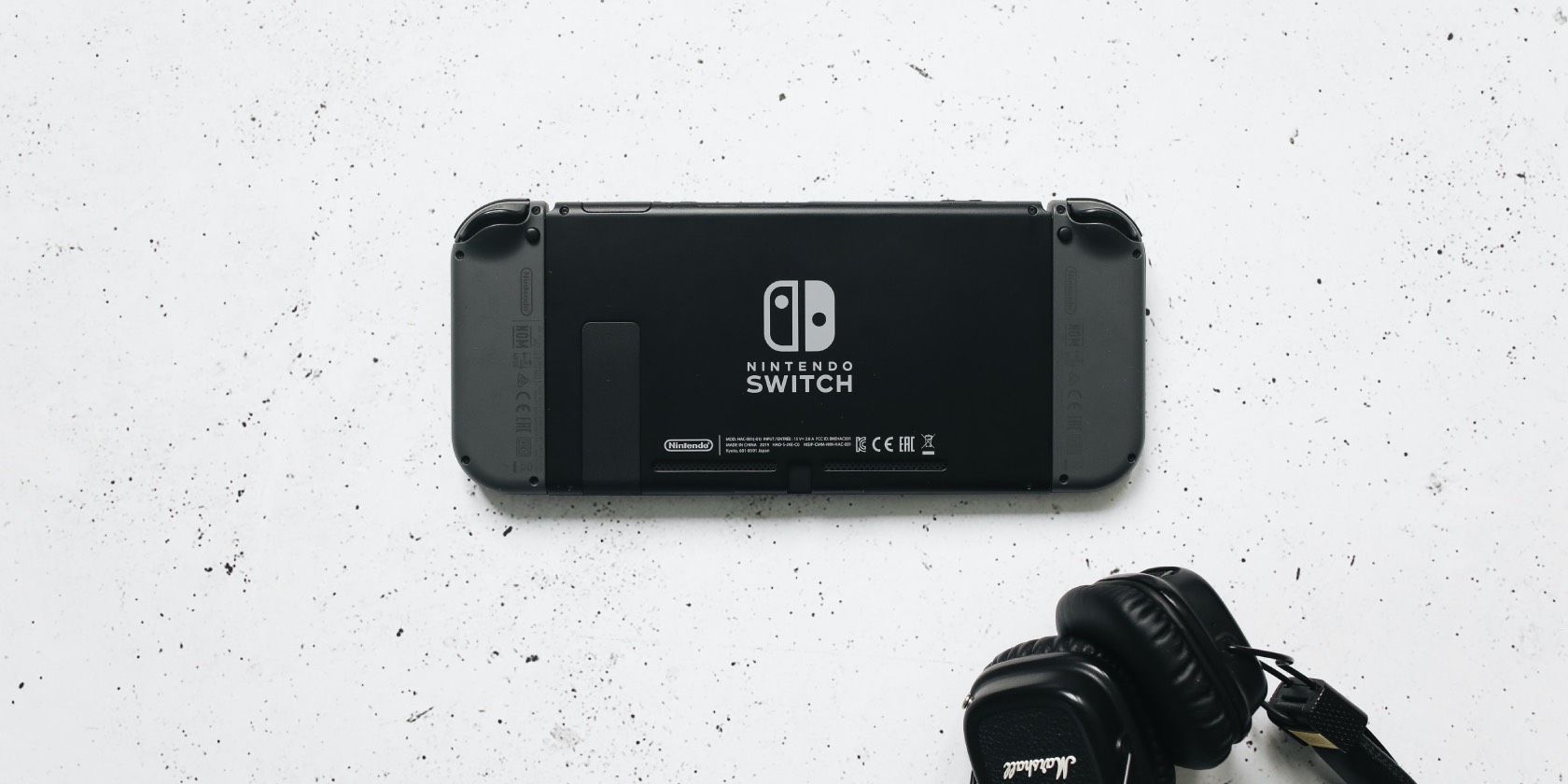 Back of Nintendo Switch with earphones