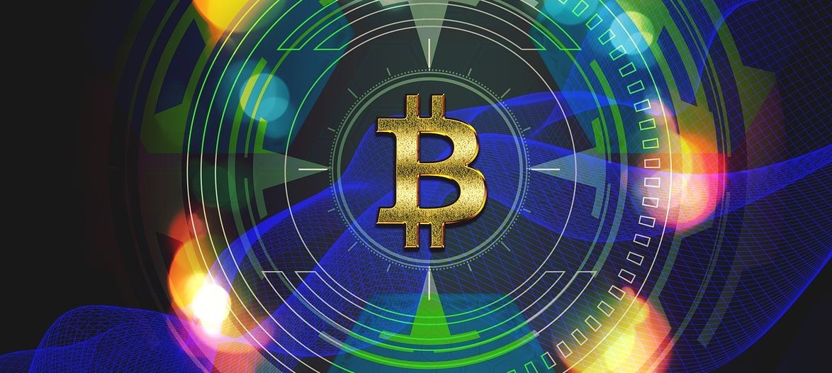 bitcoin symbol within colourful rays