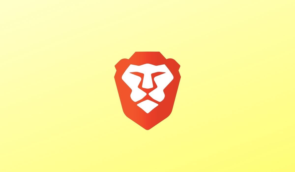 The logo of Brave browser seen on a yellow background