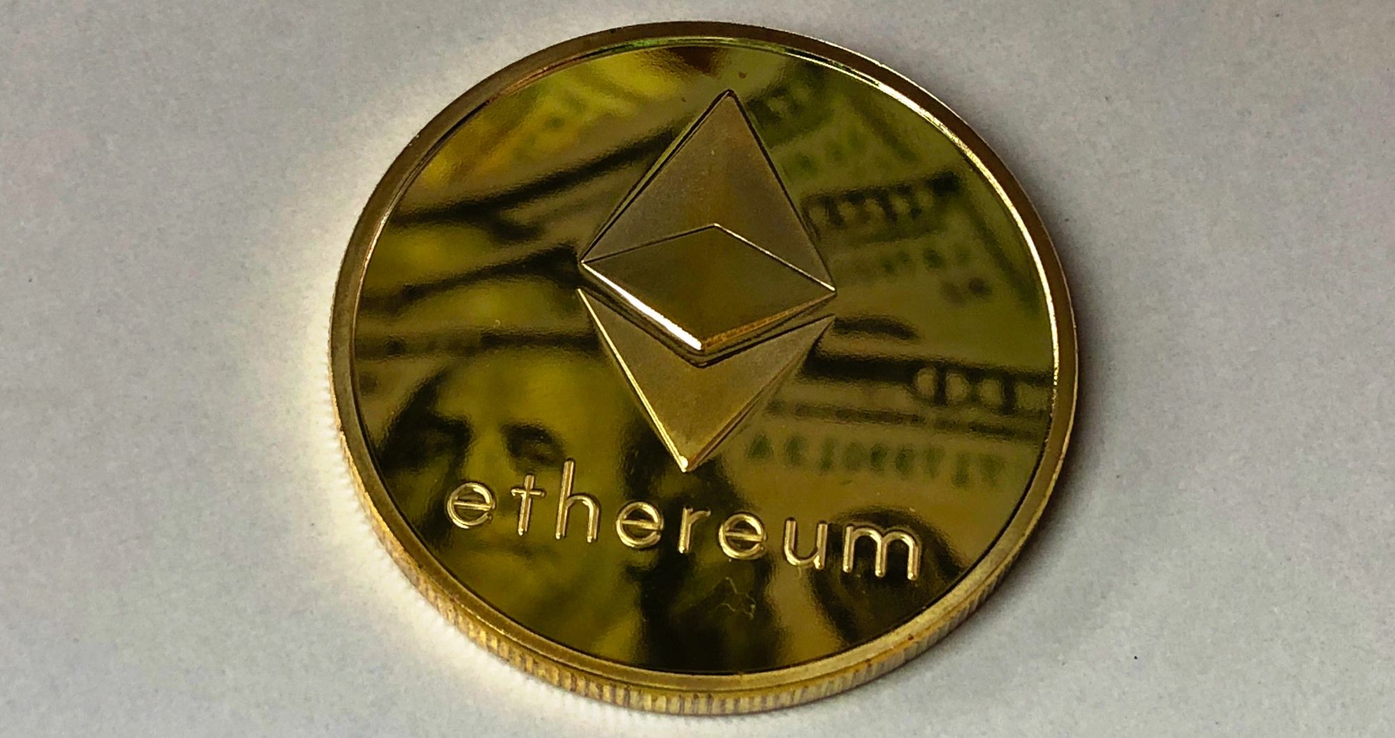 ethereum coin with american dollars in reflection