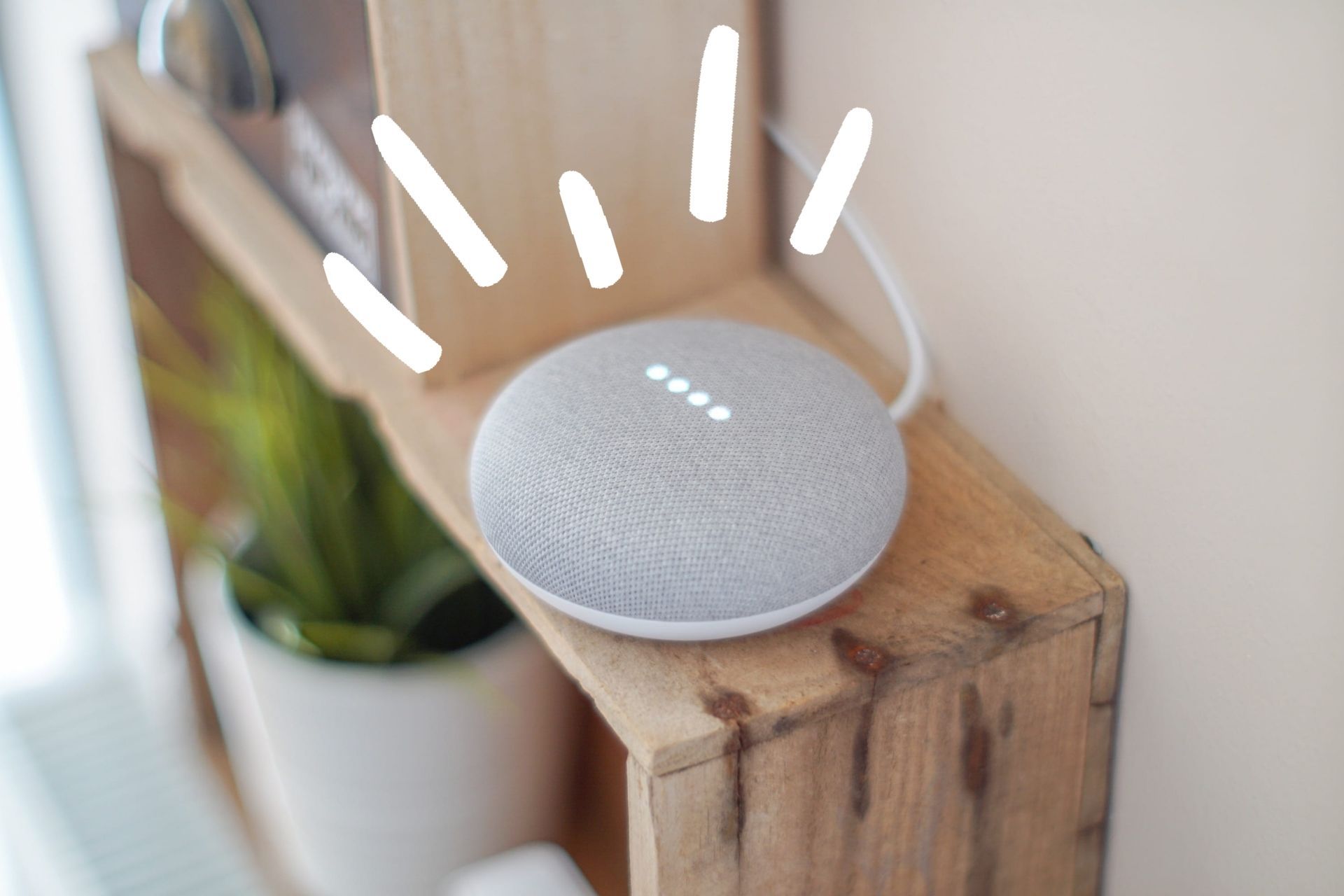 gray google nest mini with graphic lines coming out of the speaker
