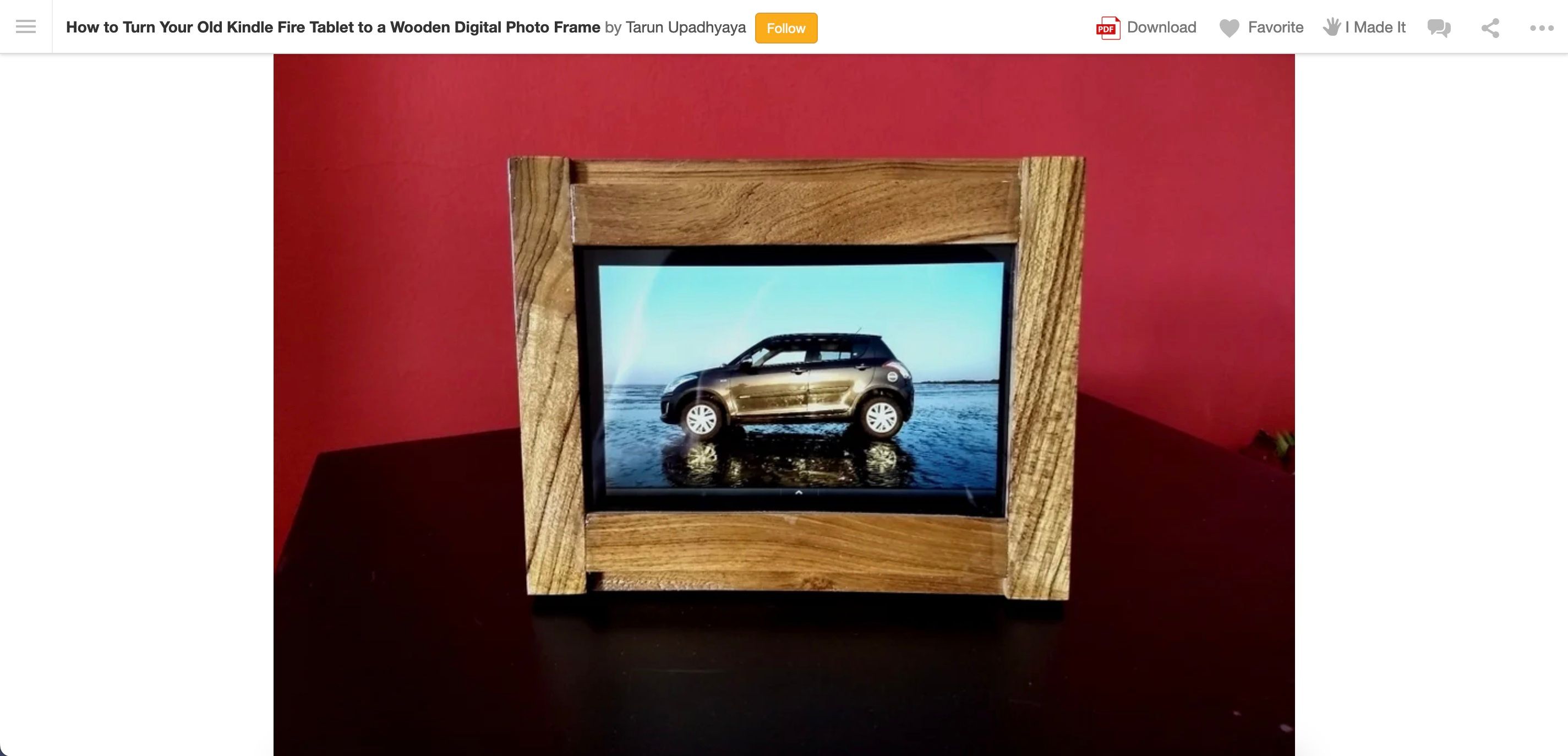 A digital picture frame made using an old Kindle Fire and wood for the frame. 