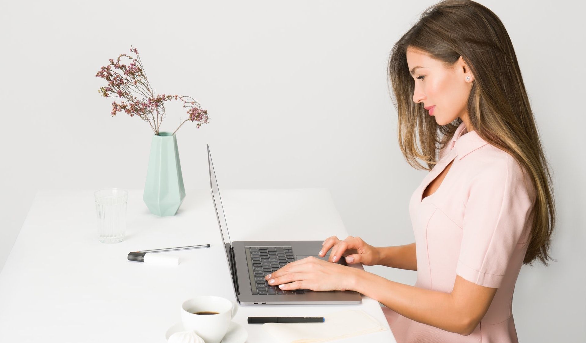Career Woman Typing on Laptop