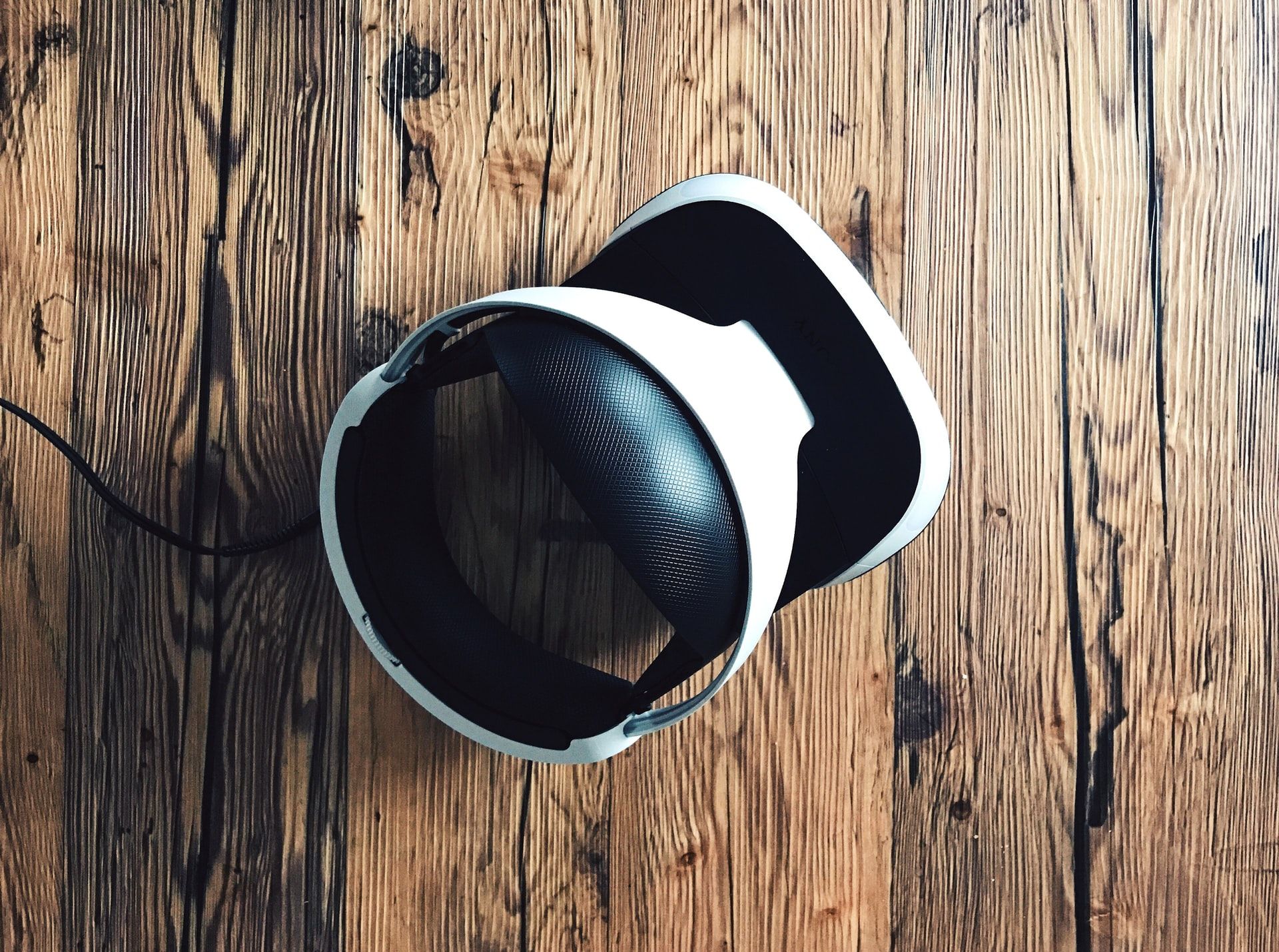 Image of the PS VR against a wooden background