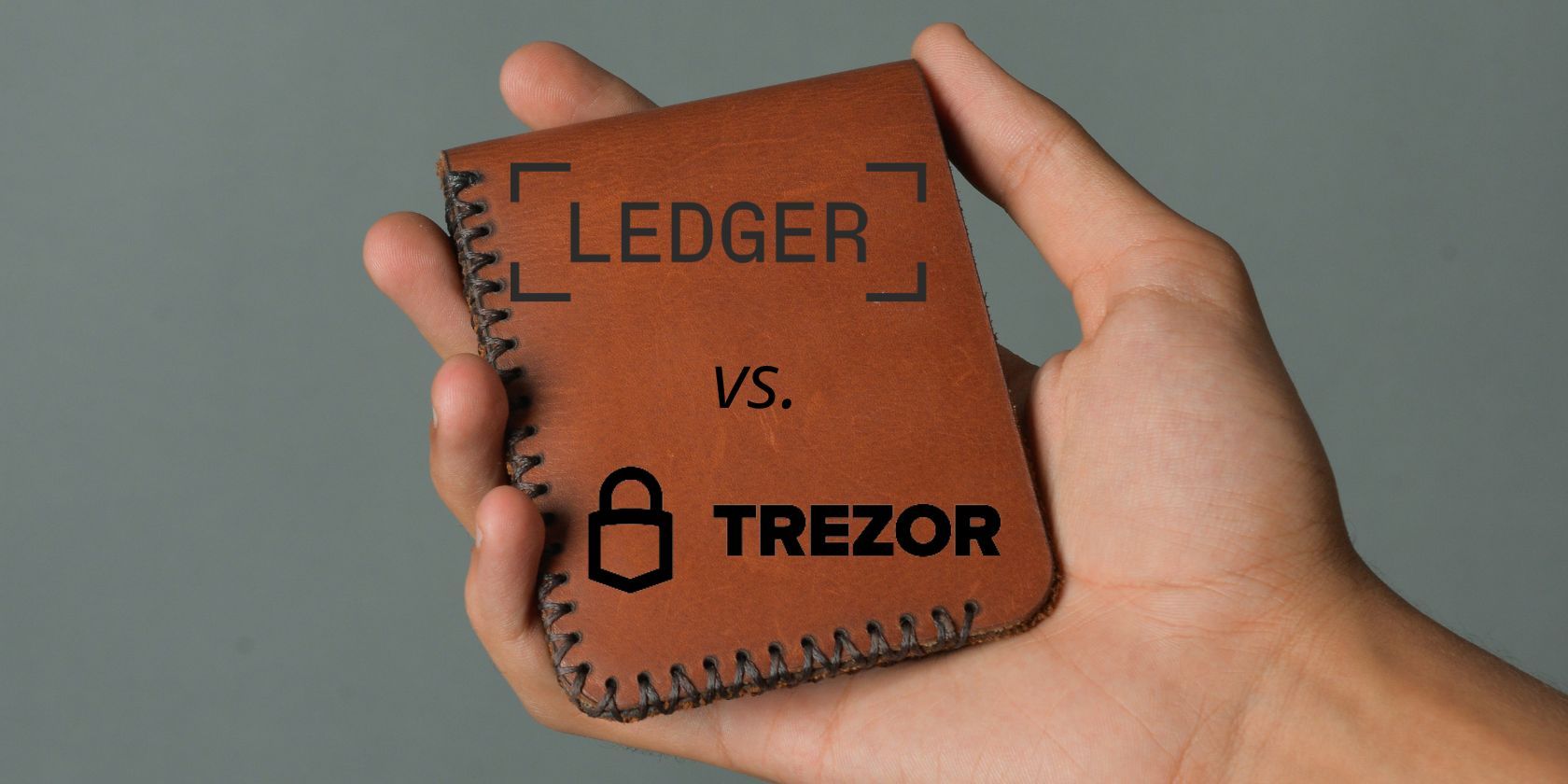 brown wallet with ledger and trezor logos on front