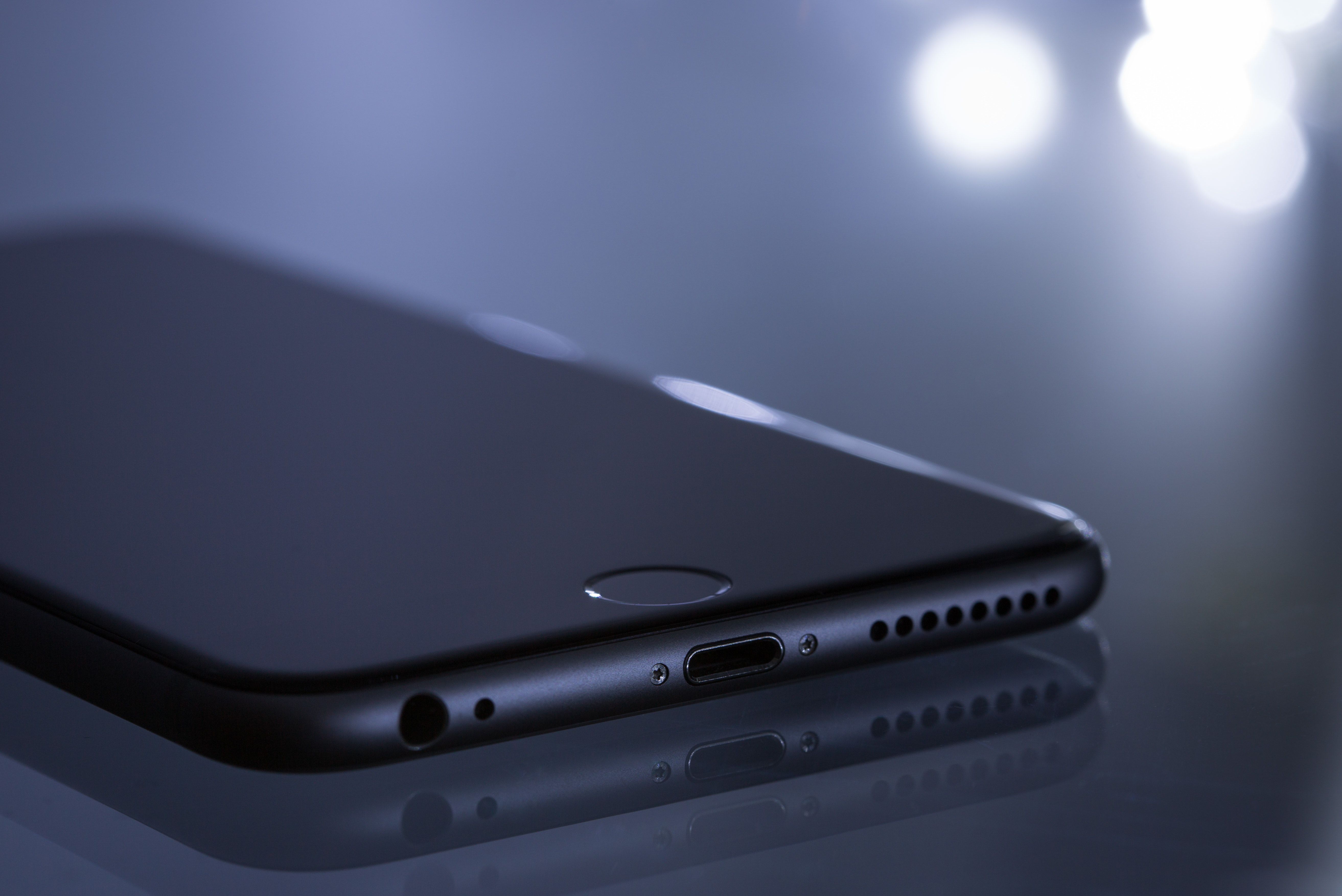 Black iPhone 6 on a glass table