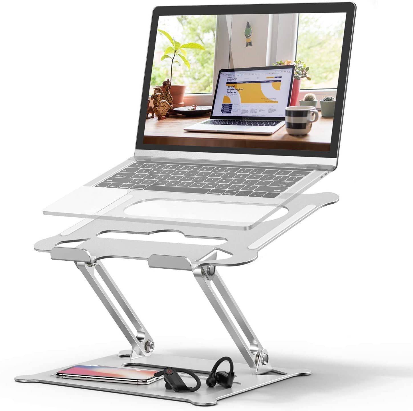 A Duchy adjustable laptop stand supporting a laptop with display on and a cellphone at its base