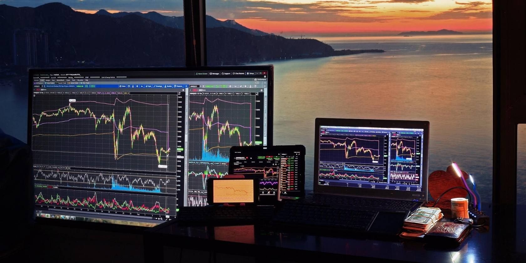 crypto charts on different computer screens