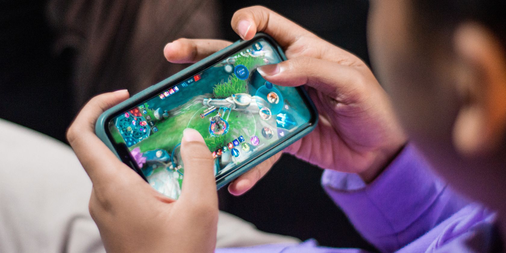 Guy playing league of legends on mobile