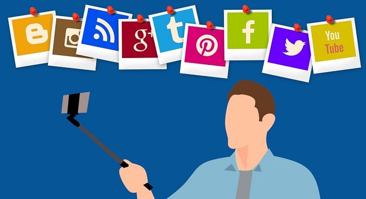 Image of man with selfie stick with social media logos above him