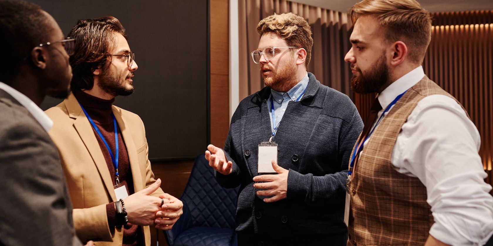 Men in Discussion at an Event