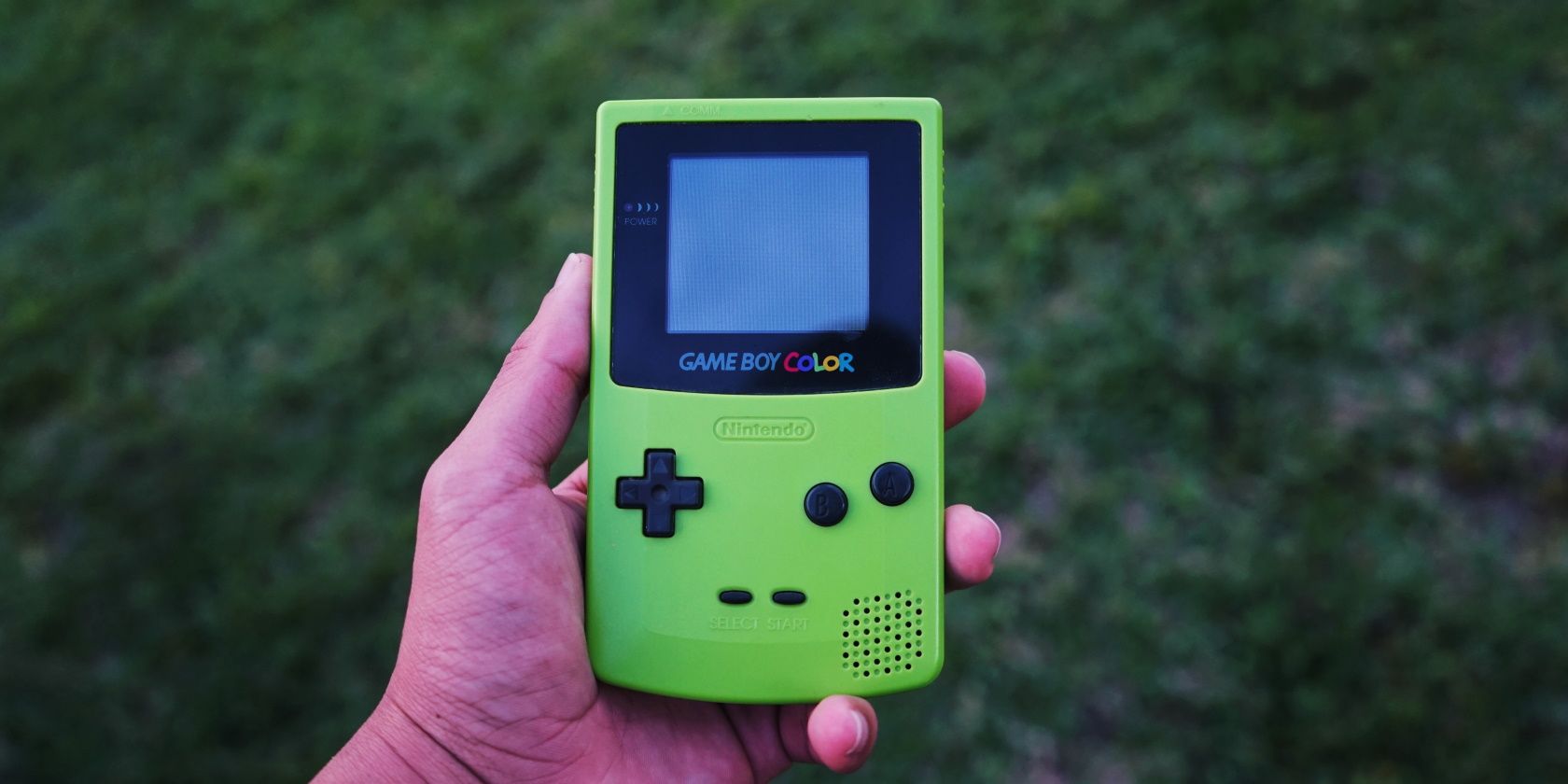 Person holding gameboy console