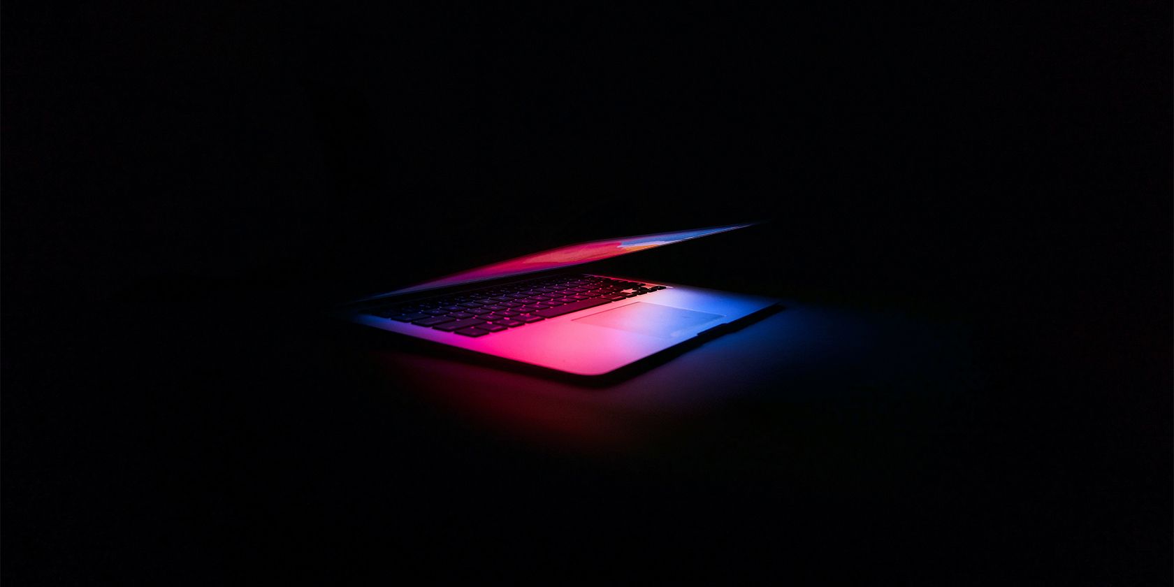 The Apple MacBook Placed on a Dark Surface