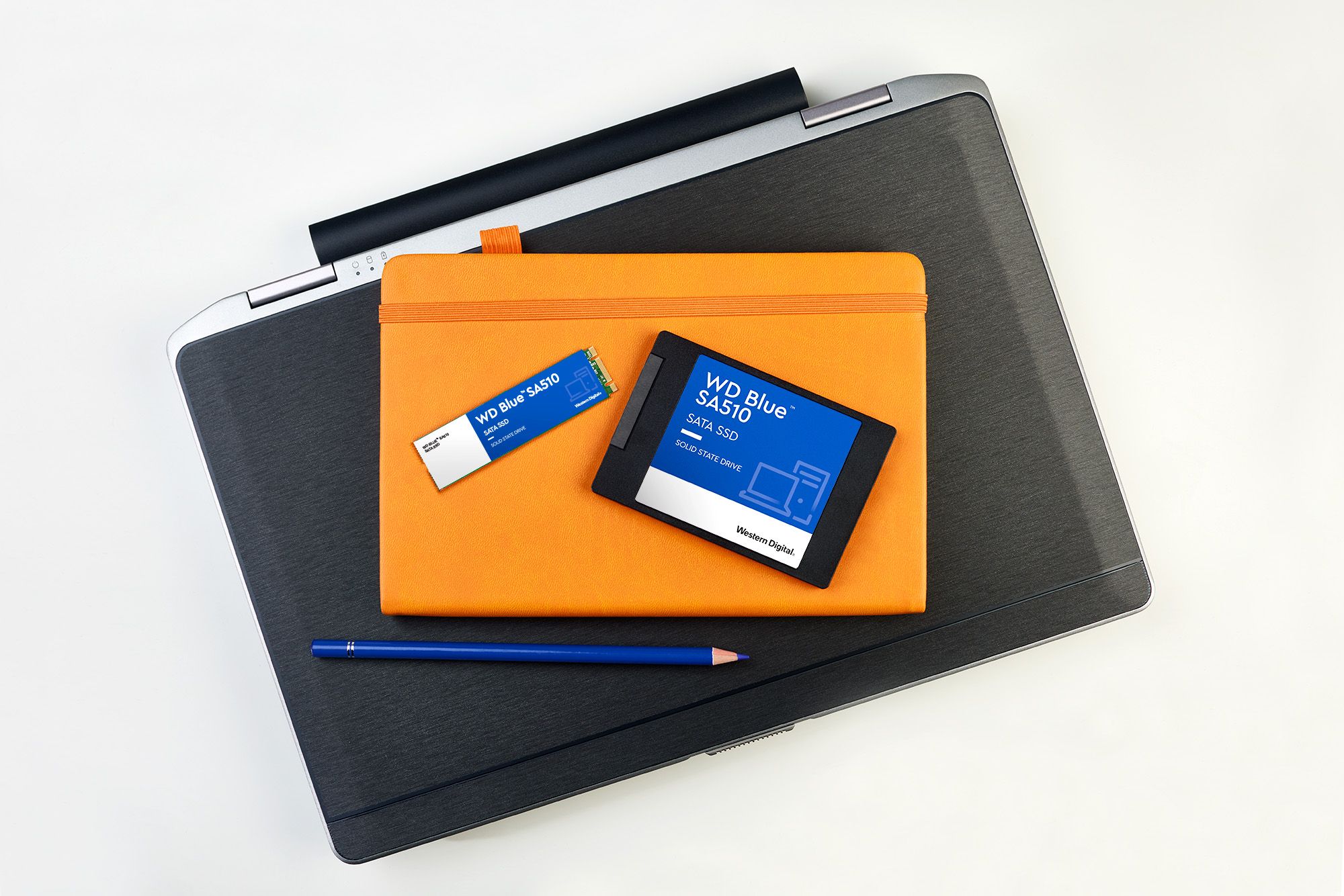 WDBlue-SA510-SATA-SSD-Lifestyle both dries-laptop-notepad