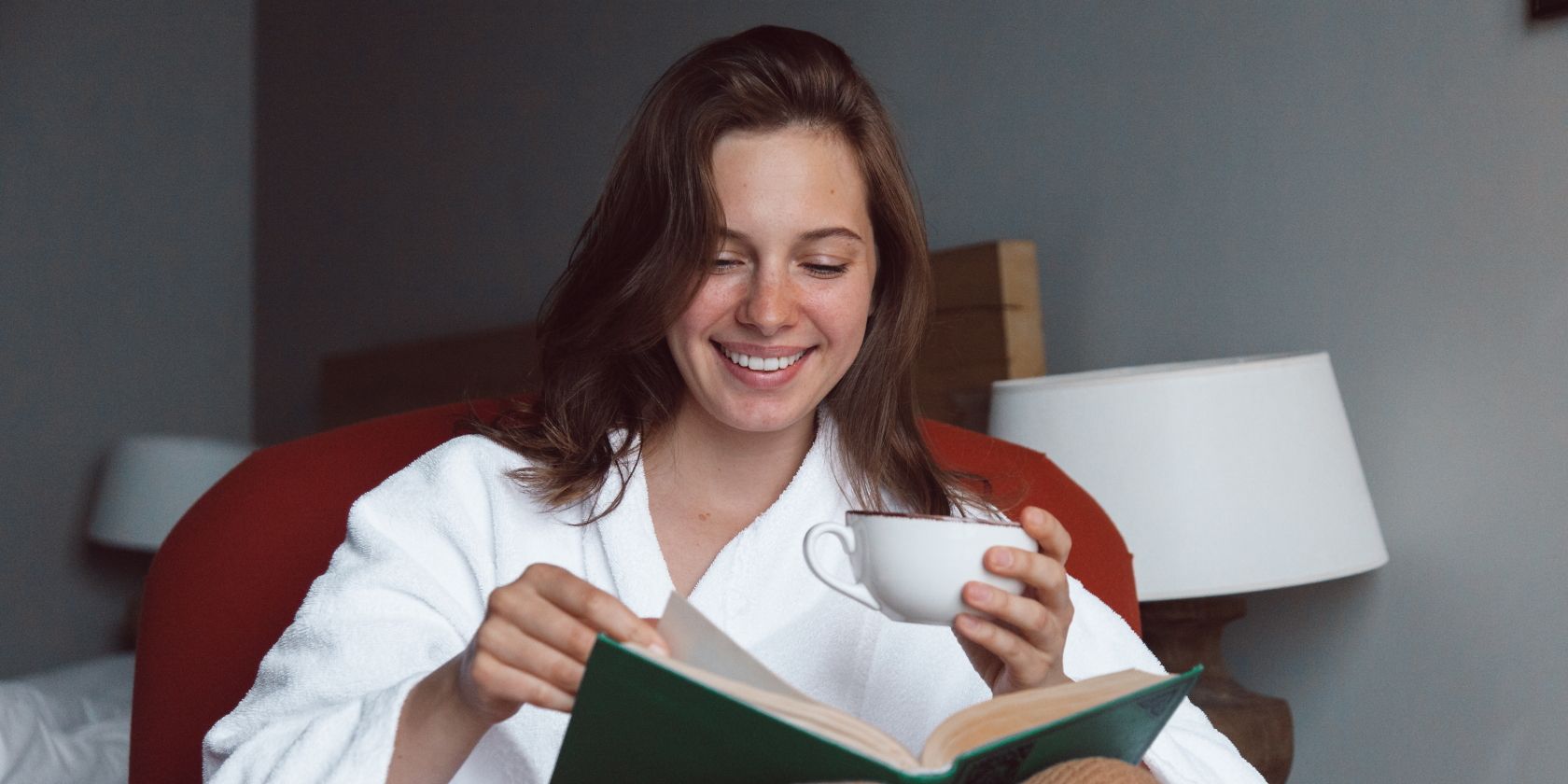 Woman Reading a Book with coffee on hand