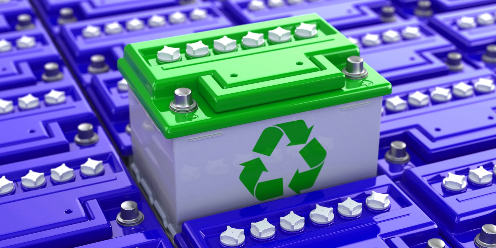 car battery with green recycling logo on front feature