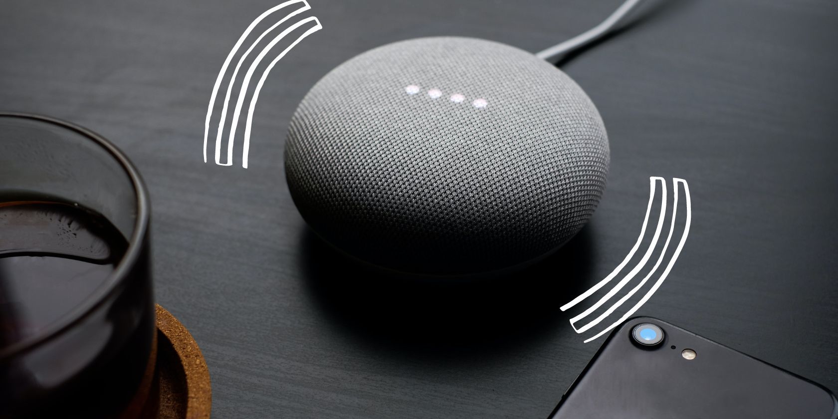 gray google home speaker with curved lines