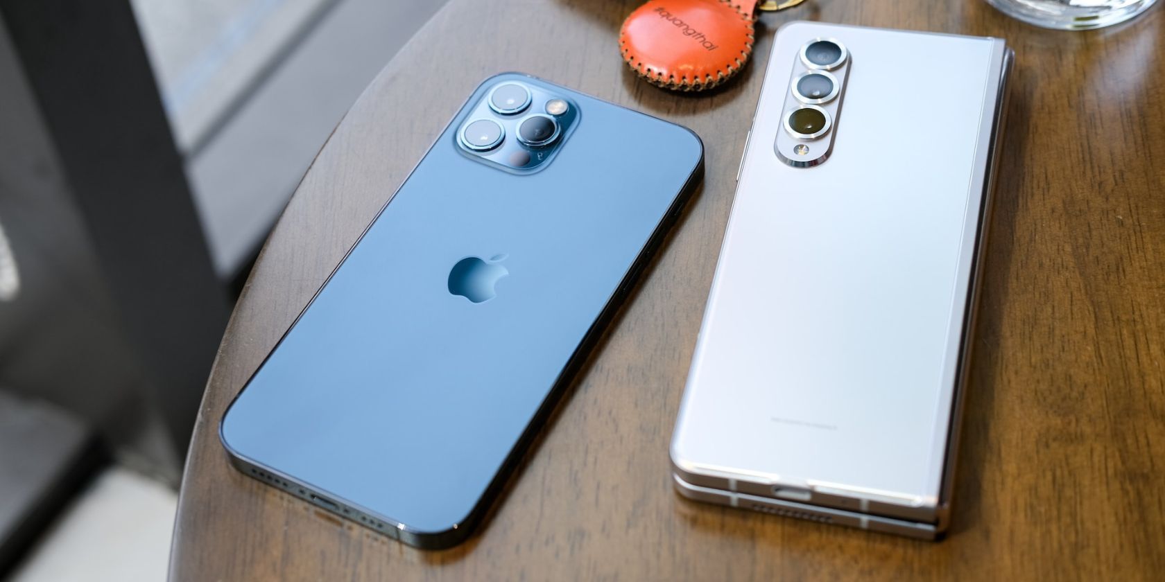 iPhone 13 Pro Pacific Blue alongside a Samsung Galaxy Z Fold 3 