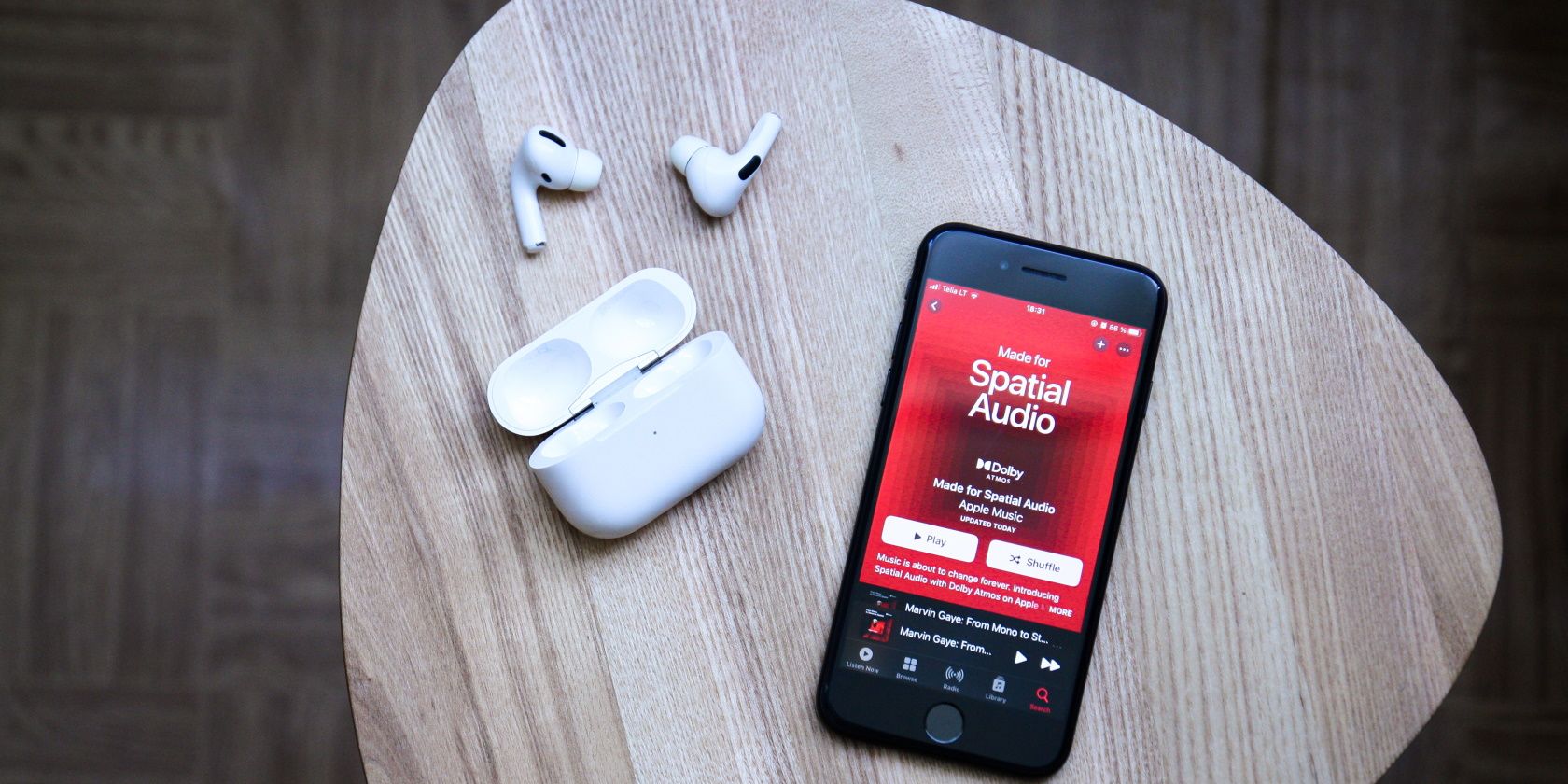iPhone with Apple Music on a table featured