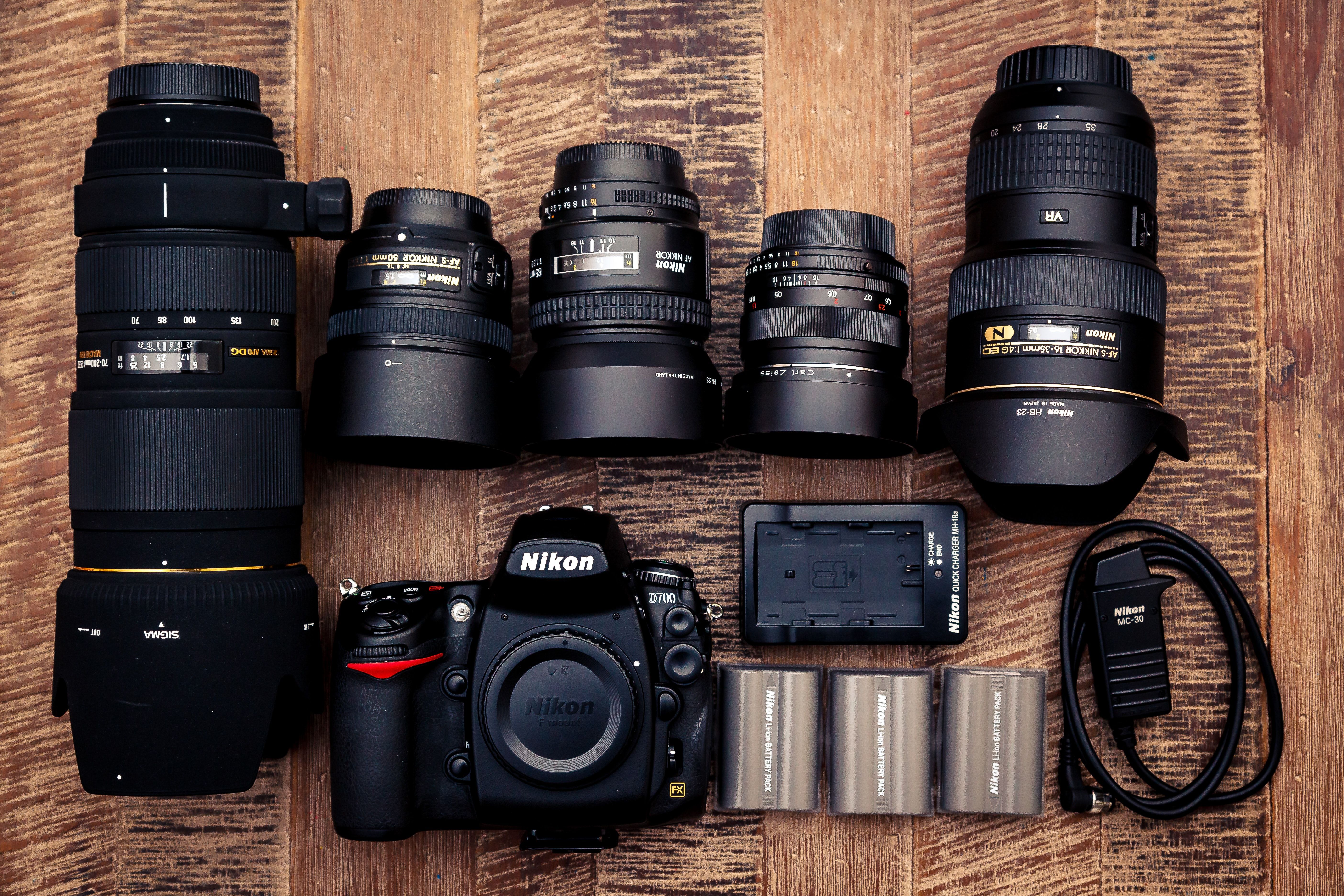 Photo of different camera lenses and bodies side by side